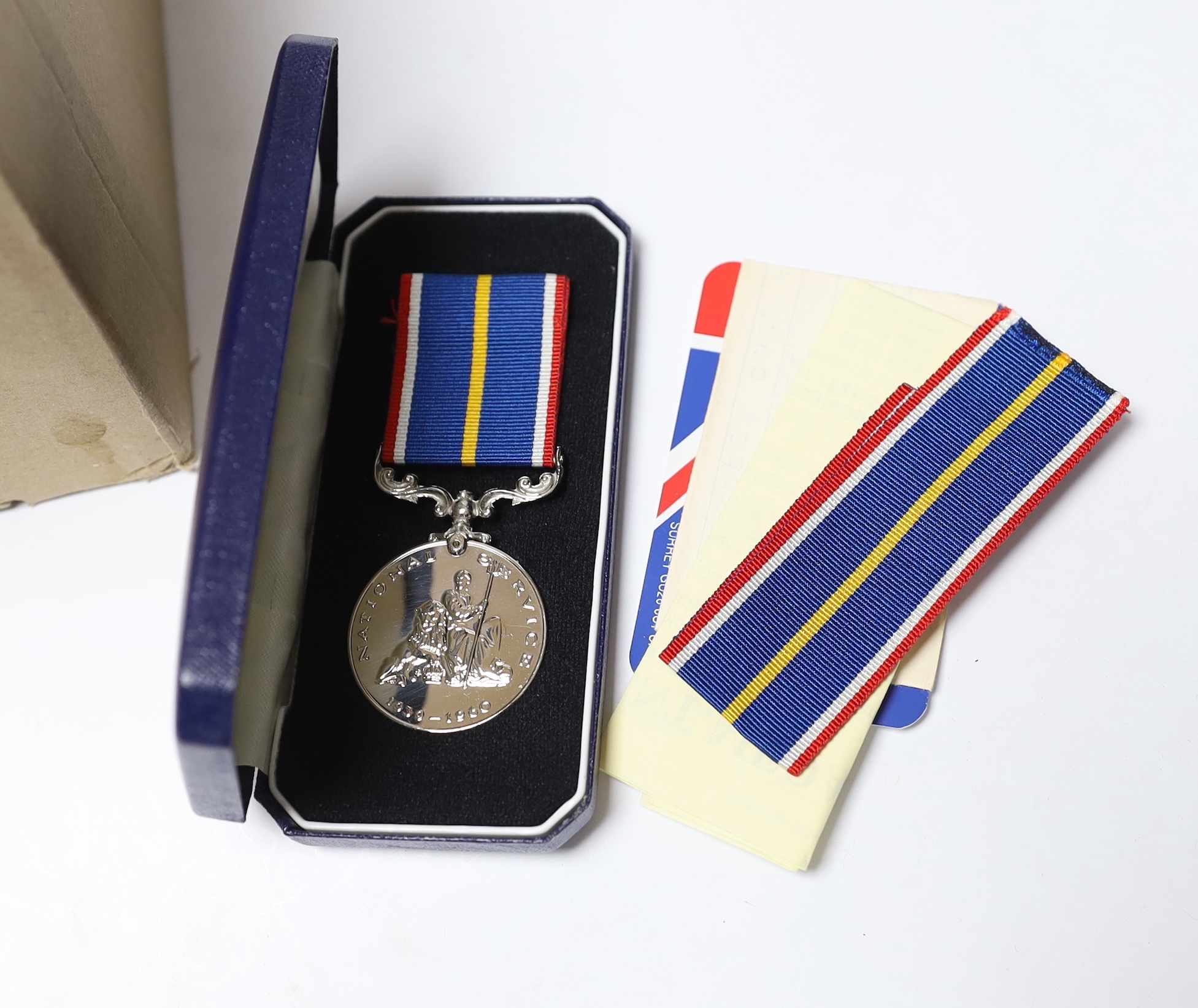 A National Service medal, various Royal Mint proof or BU coin sets etc.